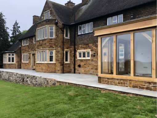 This is a photo of Bespoke wooden Bi folding doors. These were installed by Bi fold doors Portsmouth